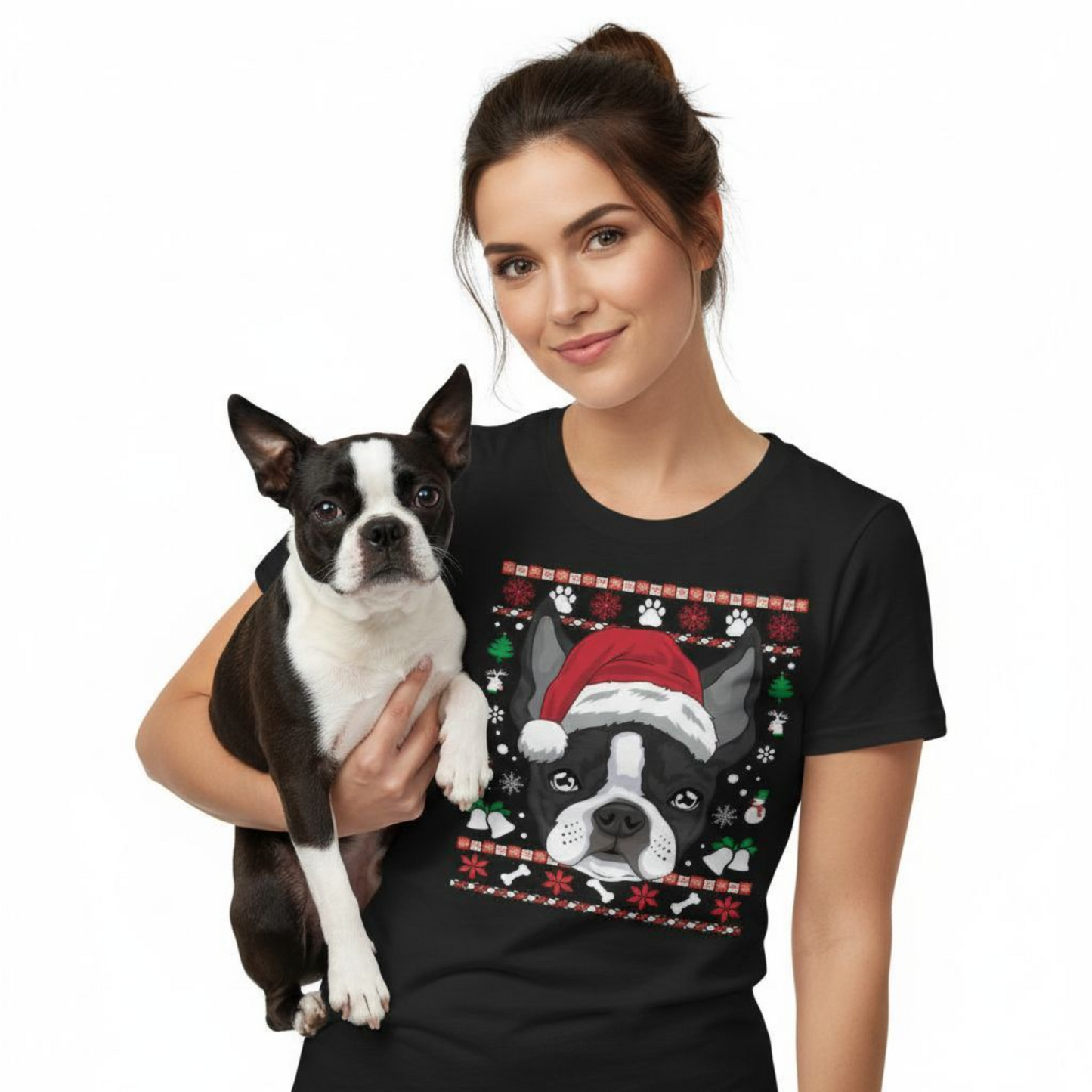 Woman wearing a black t-shirt with a dog graphic, holding a small black and white dog.