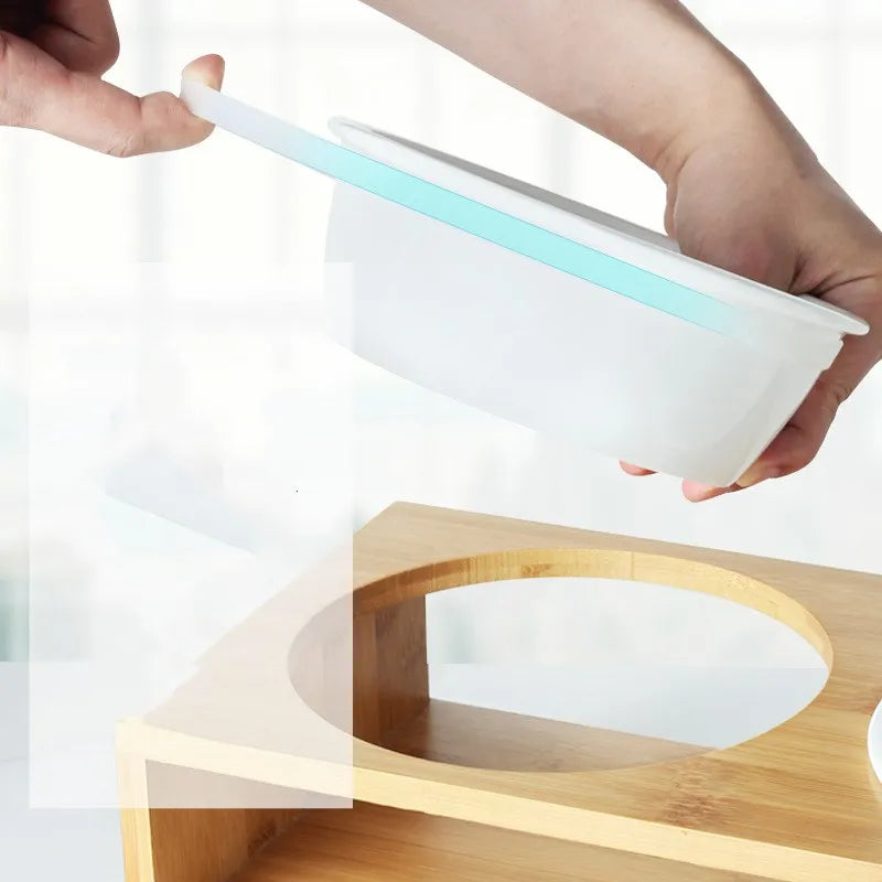 Ceramic Dog Bowl On Bamboo Table .