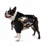 Dog wearing a hoodie with a pattern of various dog faces on a white background